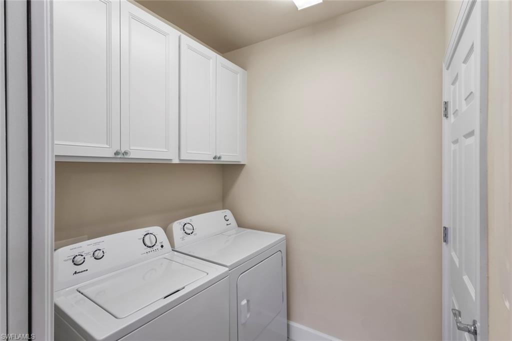 5701 Mayflower Way, Unit 1302 Ave Maria, FL 34142 - Photo 22 of 32 a utility room with dryer and washer