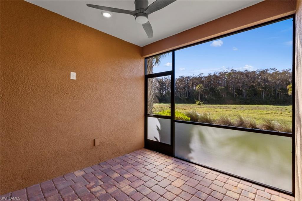 5701 Mayflower Way, Unit 1302 Ave Maria, FL 34142 - Photo 23 of 32 a view of a swimming pool and an outdoor seating