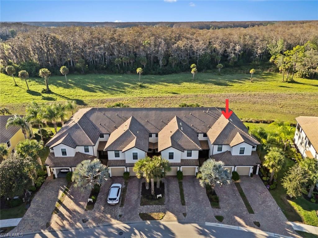 5701 Mayflower Way, Unit 1302 Ave Maria, FL 34142 - Photo 29 of 32 an aerial view of a house with a ocean view