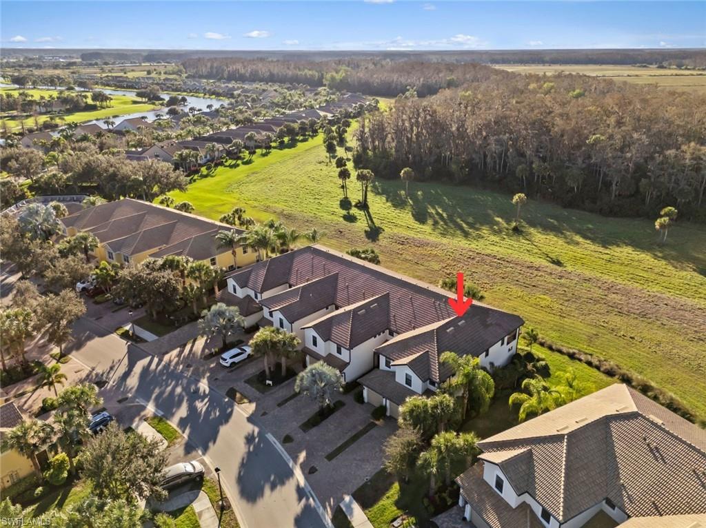 5701 Mayflower Way, Unit 1302 Ave Maria, FL 34142 - Photo 30 of 32 a view of a city and an ocean