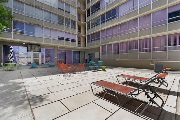 a view of a building with backyard