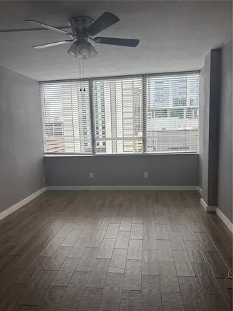 a view of an empty room and window