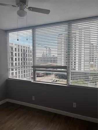 a view of a window with an umbrella in the room
