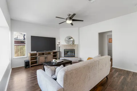 a living room with furniture and a flat screen tv