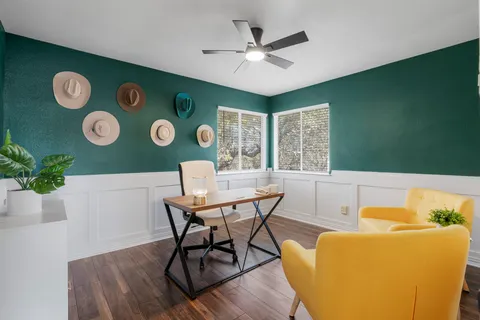 a view of a dining room with furniture window and wooden floor