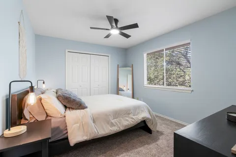 a bedroom with a bed and window