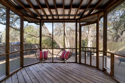 a view of an outdoor space with wooden floor and outdoor seating