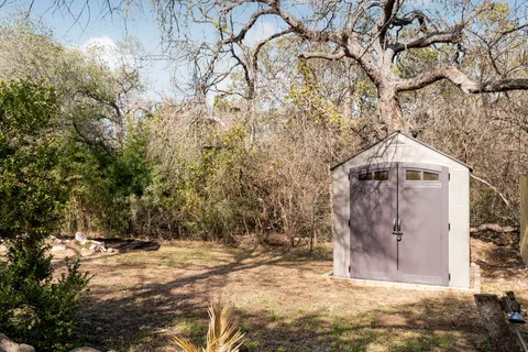 a backyard of a house with lots of green space