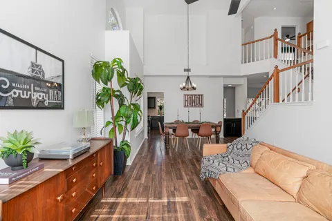 a living room with furniture and a potted plant