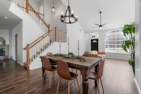 a view of a dining room with furniture window and wooden floor