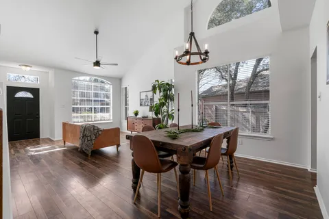 a view of a dining room with furniture window and wooden floor