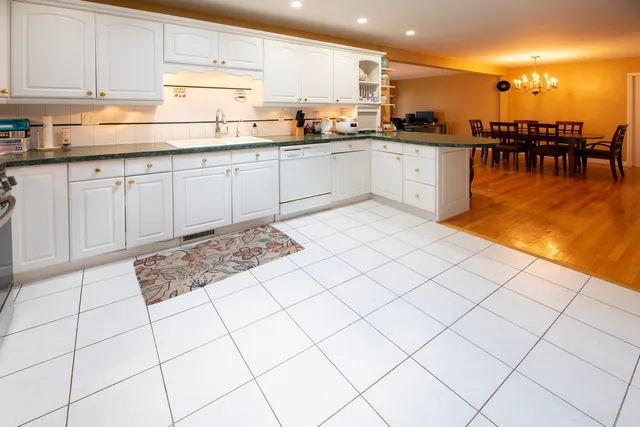 a kitchen with stainless steel appliances granite countertop a sink and cabinets