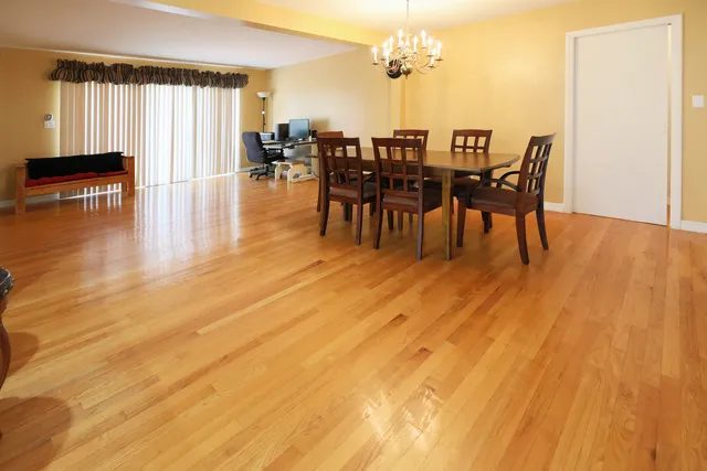 a view of a dining room with furniture and wooden floor