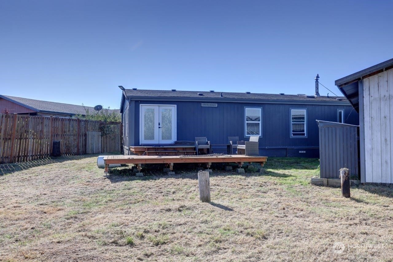 226 Stringtown Road Ilwaco, WA 98624 - Photo 34 of 40 a backyard of a house with barbeque oven