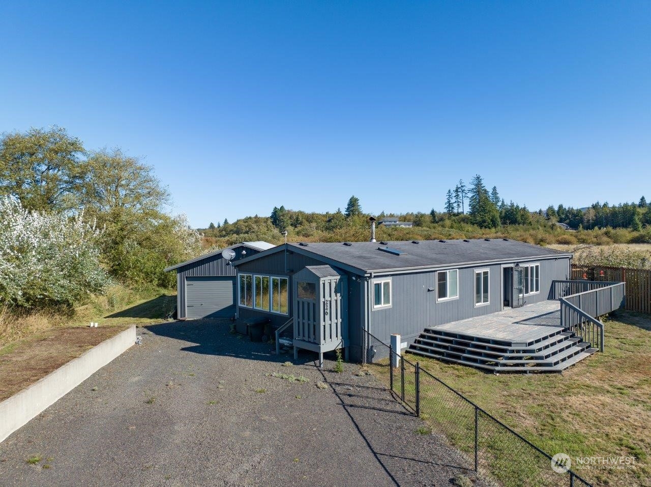 226 Stringtown Road Ilwaco, WA 98624 - Photo 5 of 40 a view of a house with a roof deck