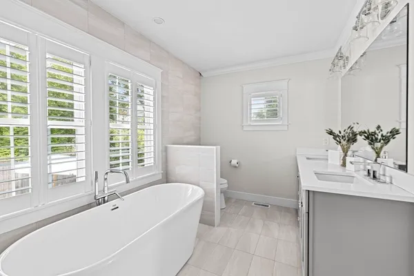 a bathroom with a bathtub and a sink