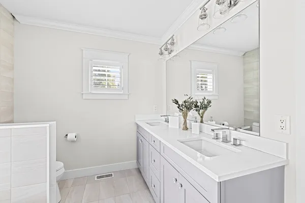 a bathroom with a sink a vanity and a mirror