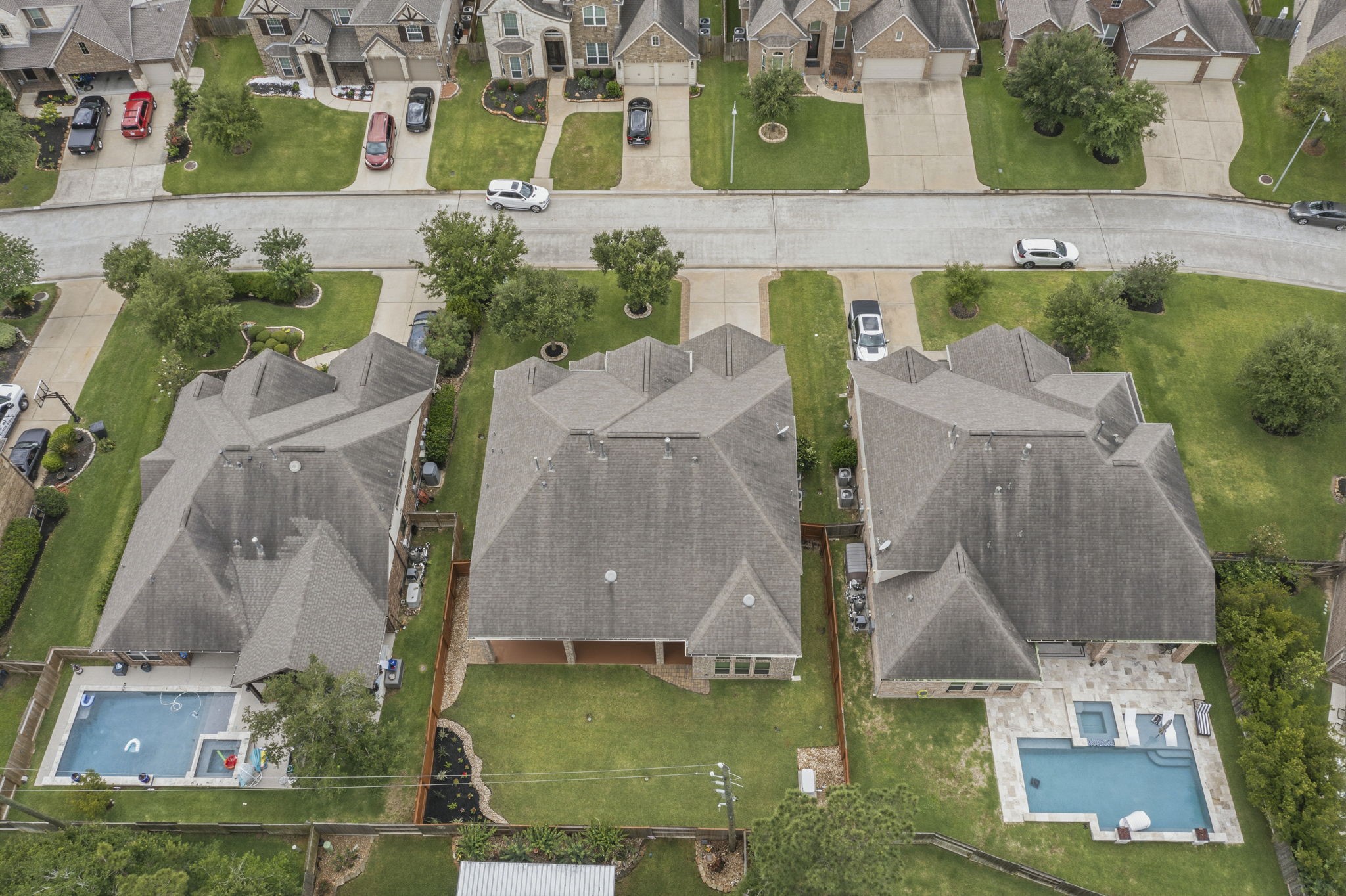 25210 Gaddis Oaks Drive Spring, TX 77389 - Photo 50 of 50 an aerial view of residential houses with outdoor space and swimming pool