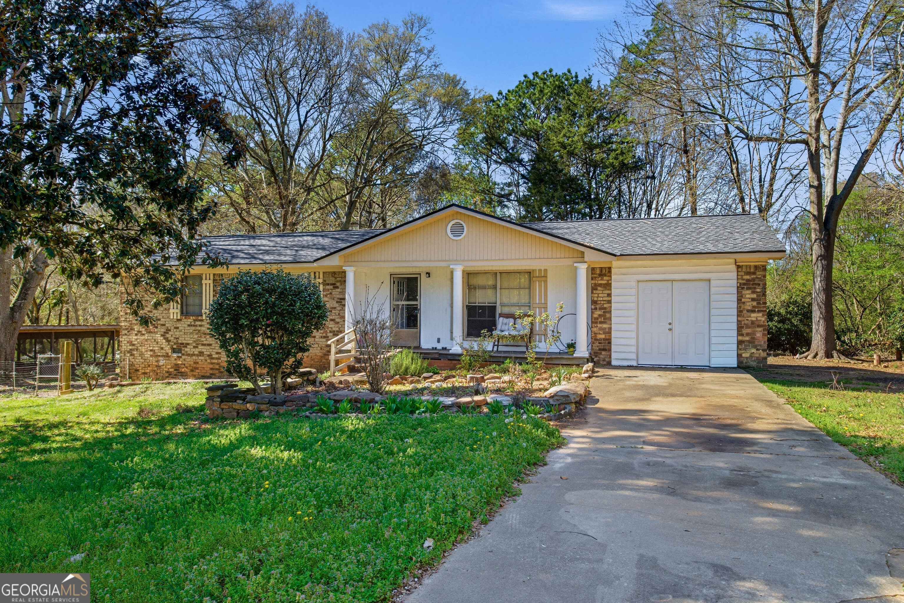 a front view of a house with a yard and porch