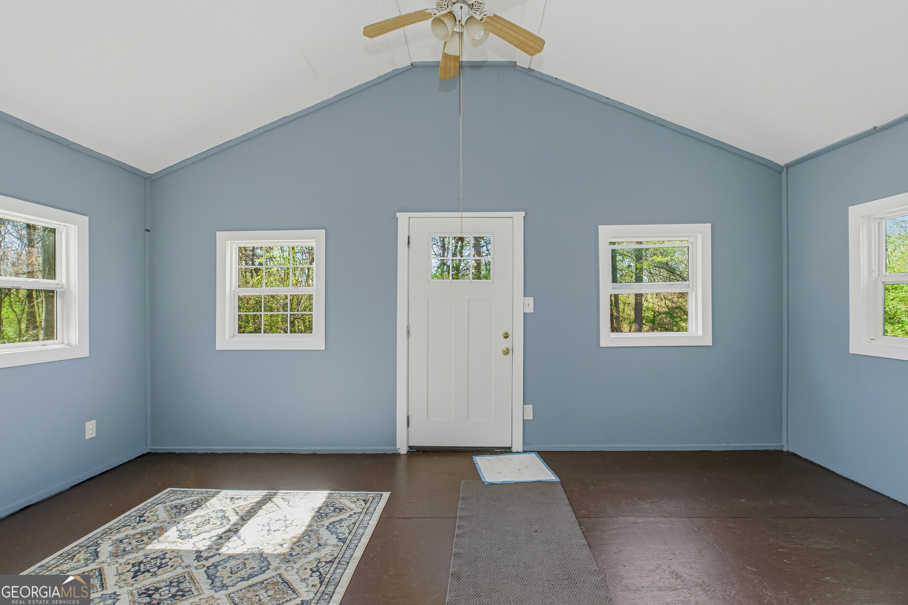 4124 Mangum Mill Road Gainesville, GA 30507 - Photo 12 of 48 a view of an empty room with window and chandelier fan