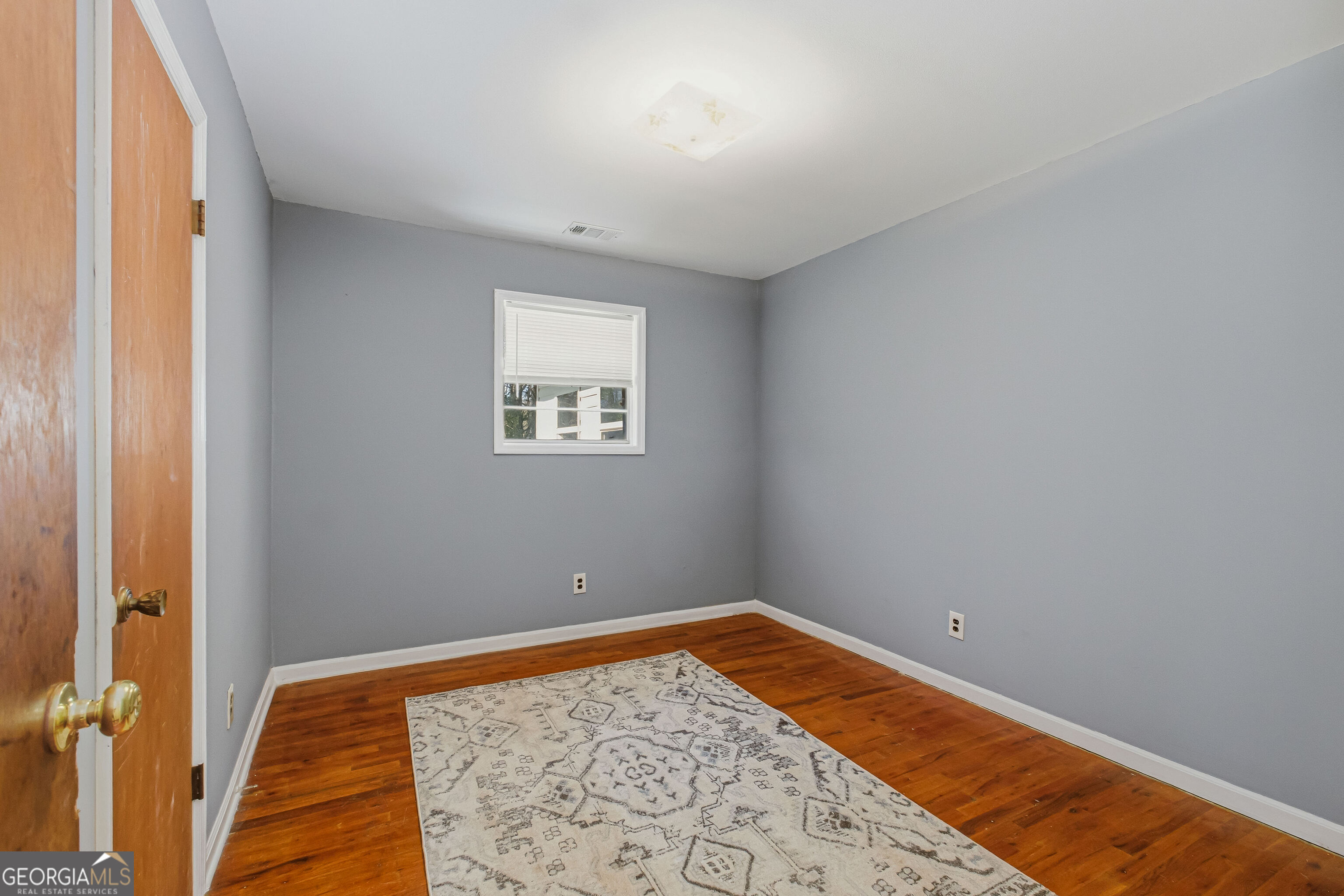 4124 Mangum Mill Road Gainesville, GA 30507 - Photo 17 of 48 a view of room with window and wooden floor