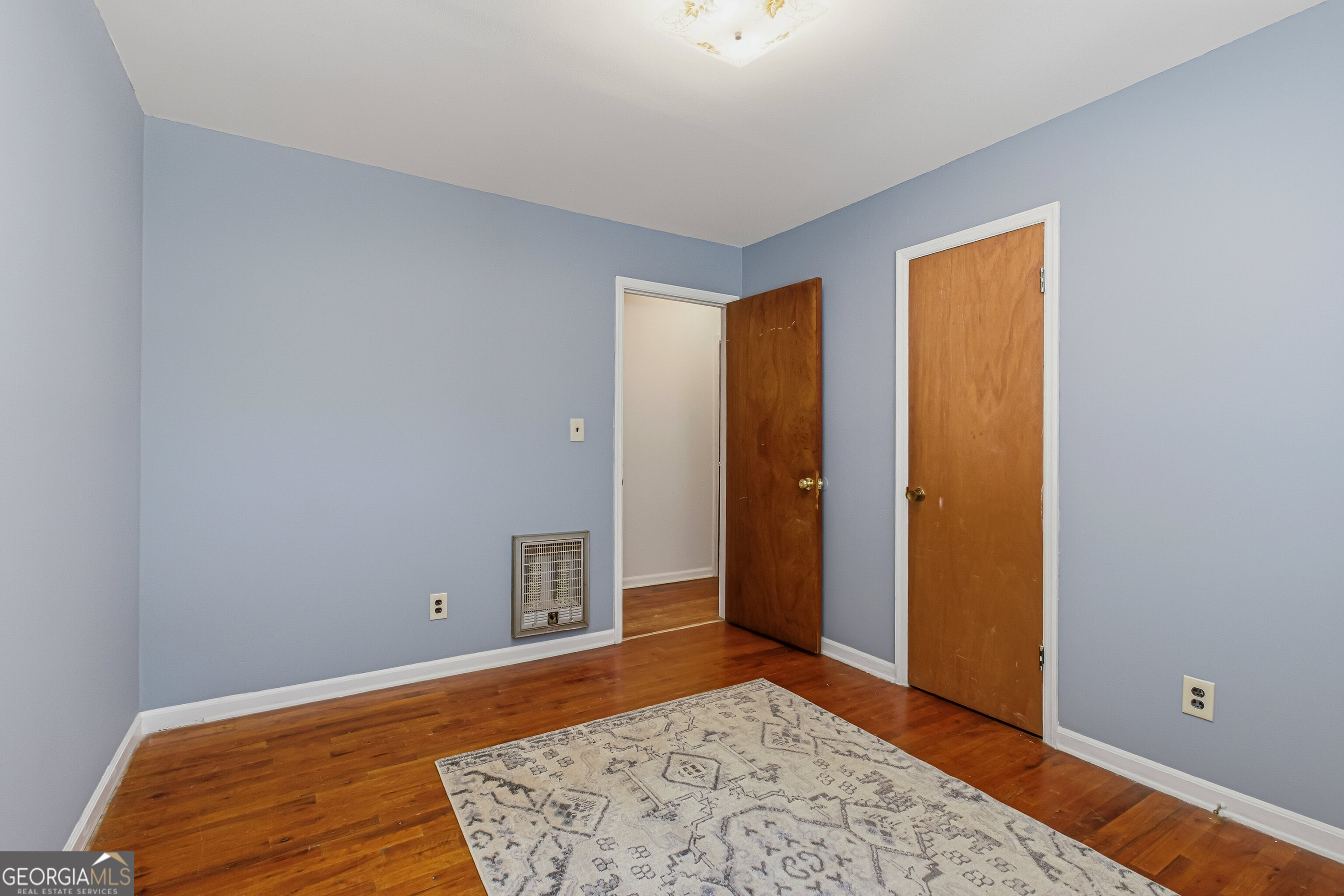 4124 Mangum Mill Road Gainesville, GA 30507 - Photo 18 of 48 a bedroom with a bed and a rug