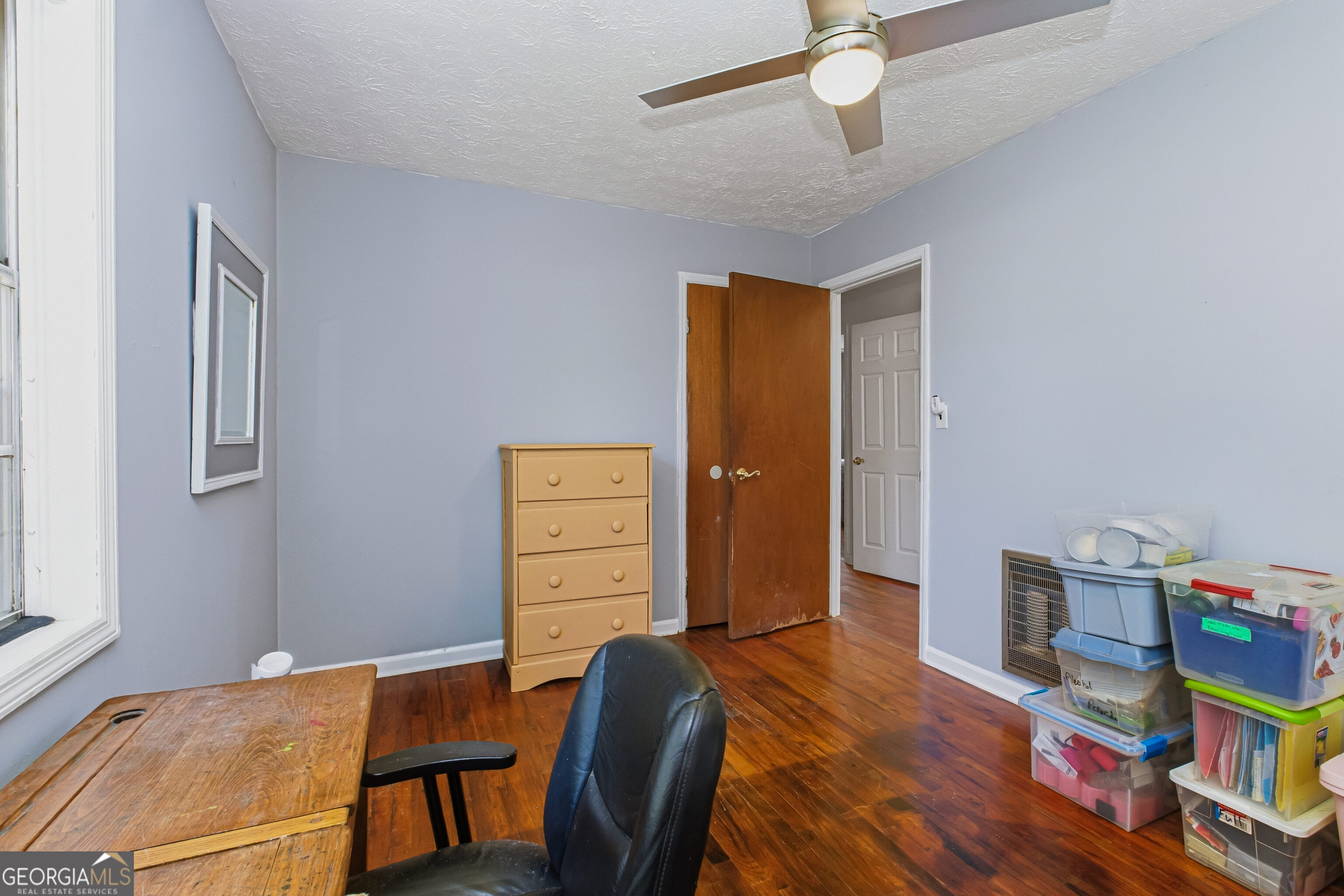 4124 Mangum Mill Road Gainesville, GA 30507 - Photo 20 of 48 a workspace with furniture and wooden floor