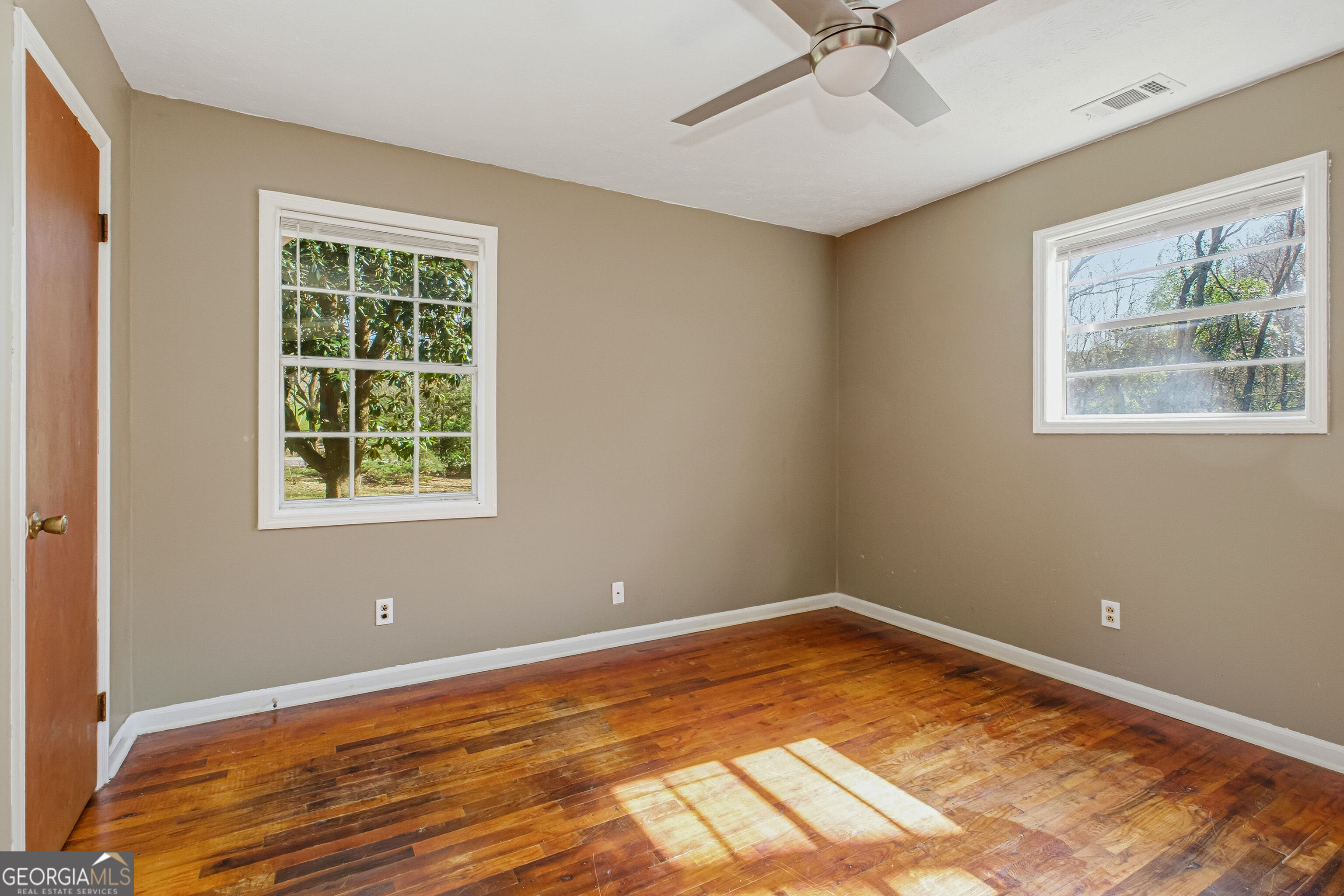 4124 Mangum Mill Road Gainesville, GA 30507 - Photo 21 of 48 an empty room with a window and ceiling fan
