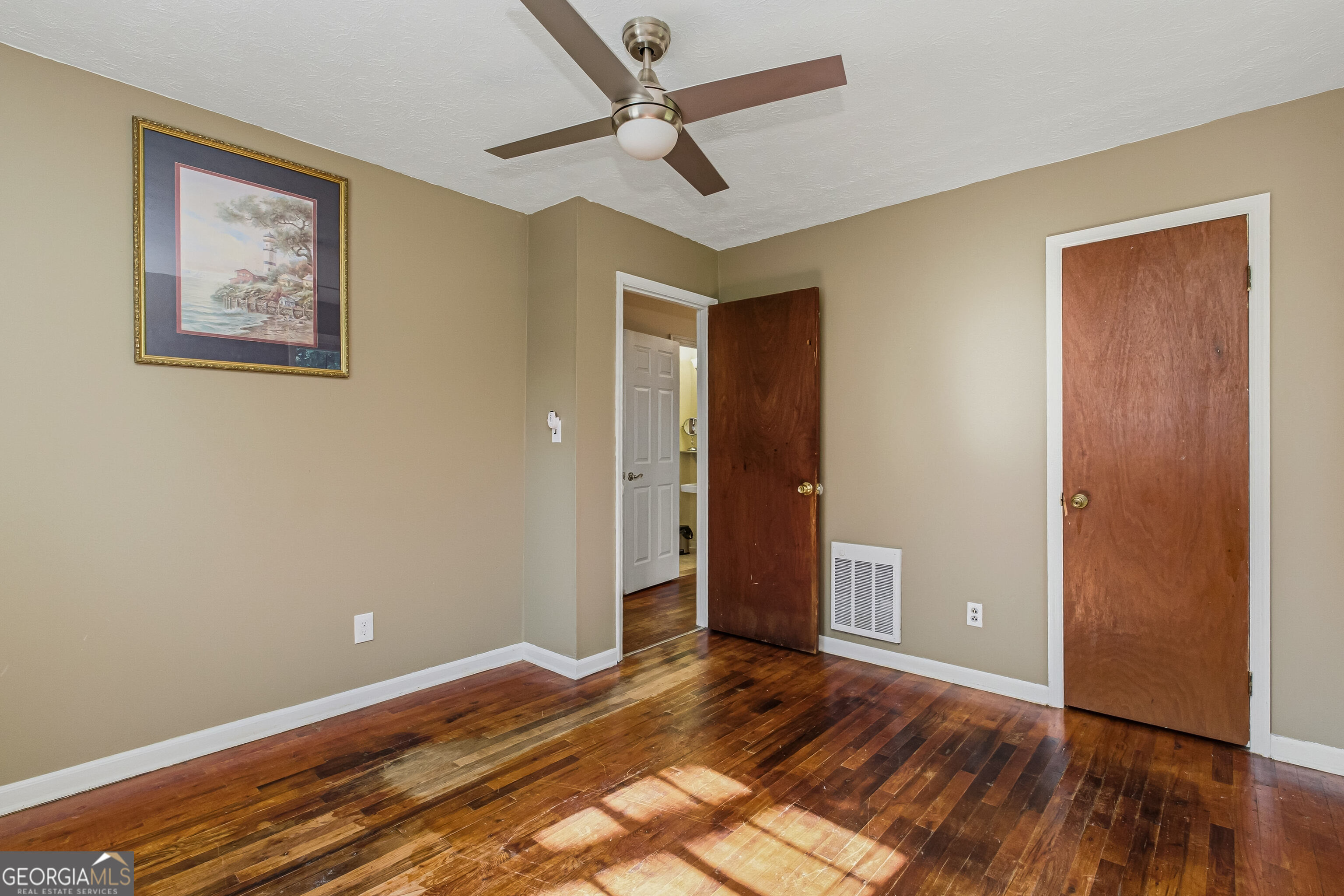 4124 Mangum Mill Road Gainesville, GA 30507 - Photo 22 of 48 a view of room with hardwood floor and ceiling fan