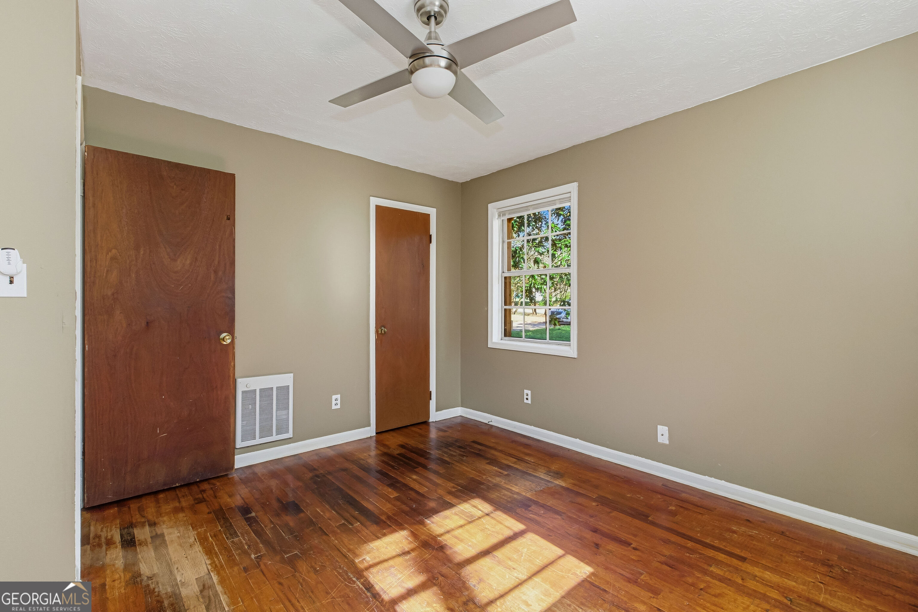 4124 Mangum Mill Road Gainesville, GA 30507 - Photo 23 of 48 wooden floor in an empty room with a window