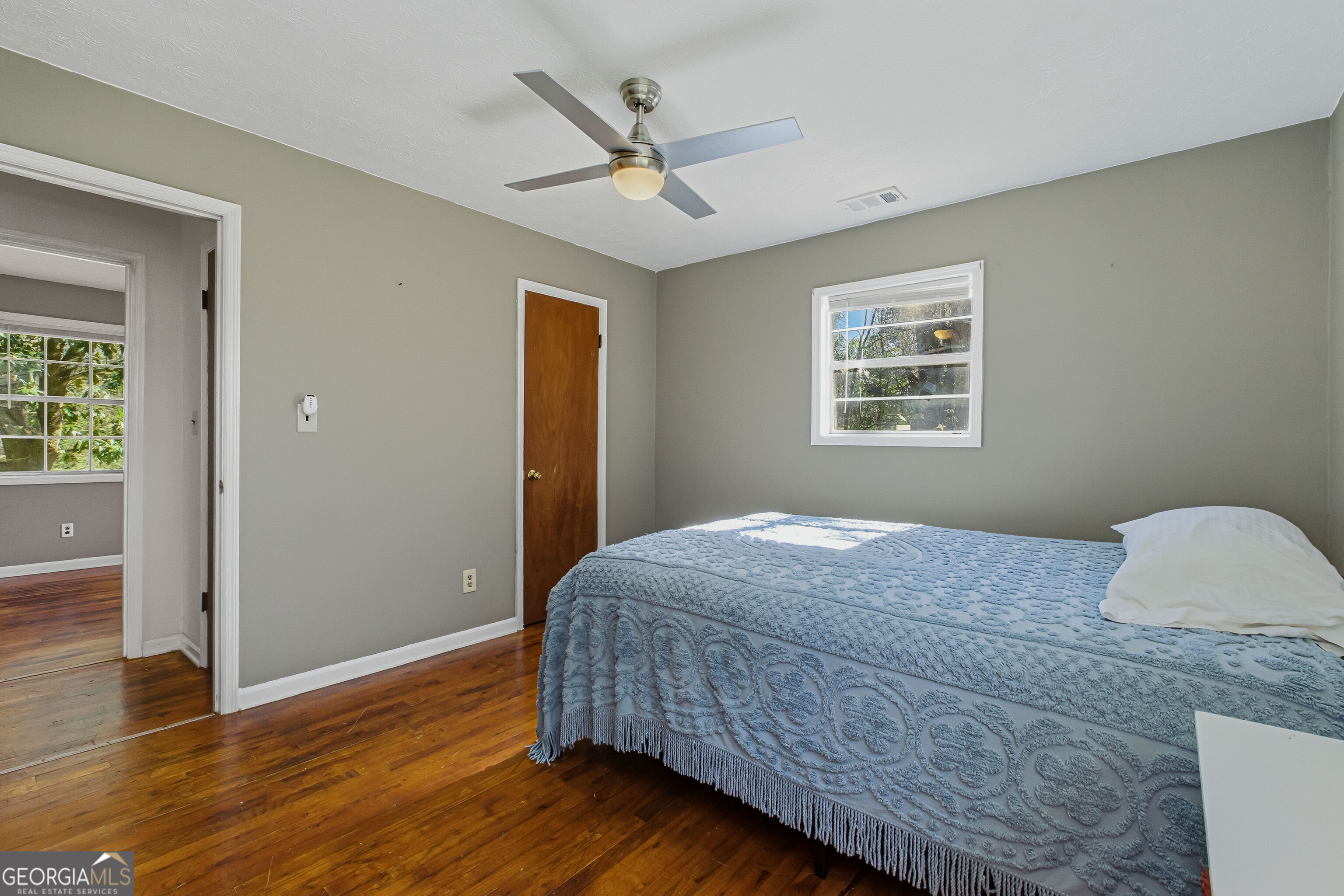4124 Mangum Mill Road Gainesville, GA 30507 - Photo 25 of 48 a bedroom with a bed and wooden floor