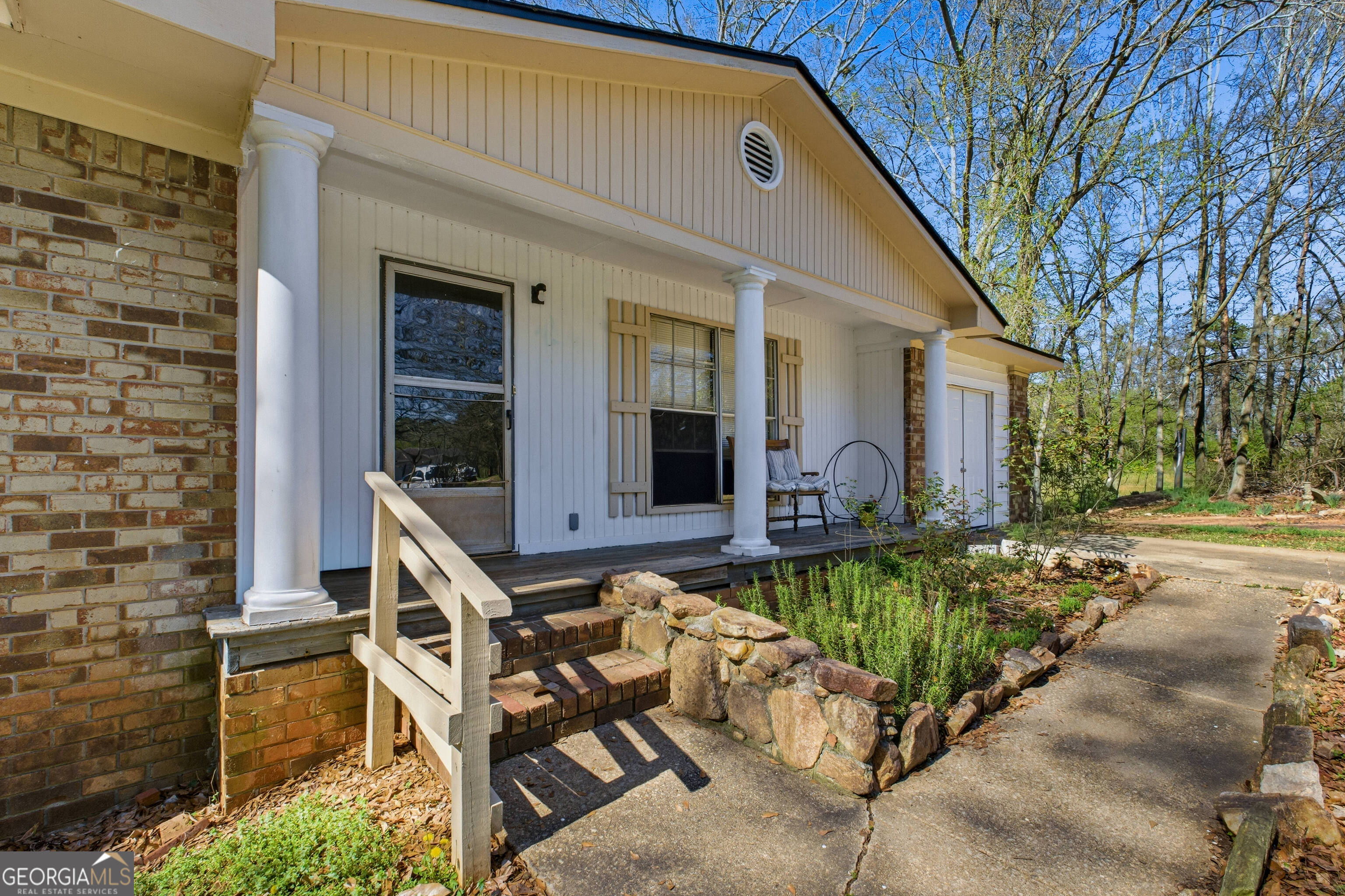 4124 Mangum Mill Road Gainesville, GA 30507 - Photo 3 of 48 a front view of a house with garden