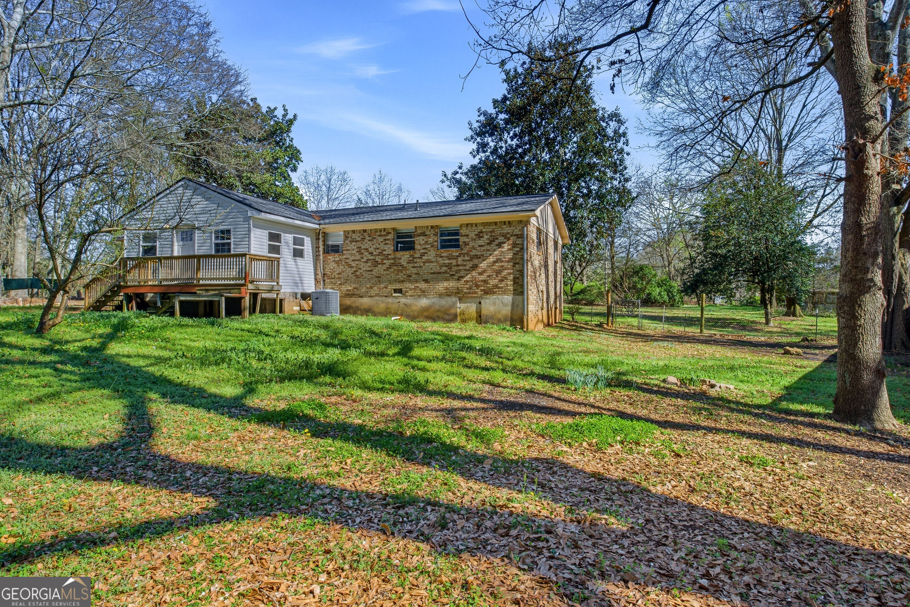 4124 Mangum Mill Road Gainesville, GA 30507 - Photo 32 of 48 a view of a big house with a big yard and large trees