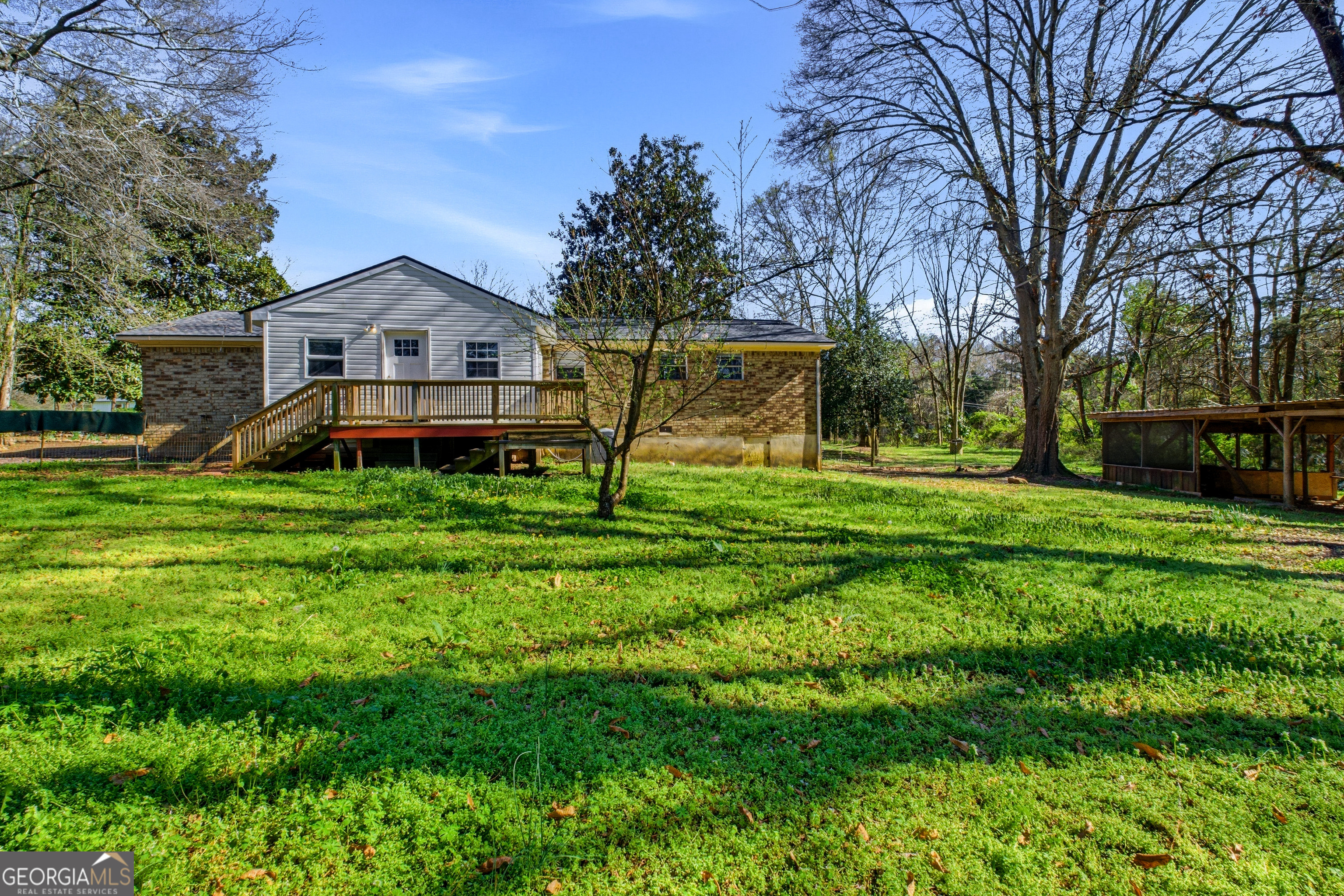 4124 Mangum Mill Road Gainesville, GA 30507 - Photo 33 of 48 a front view of a house with garden