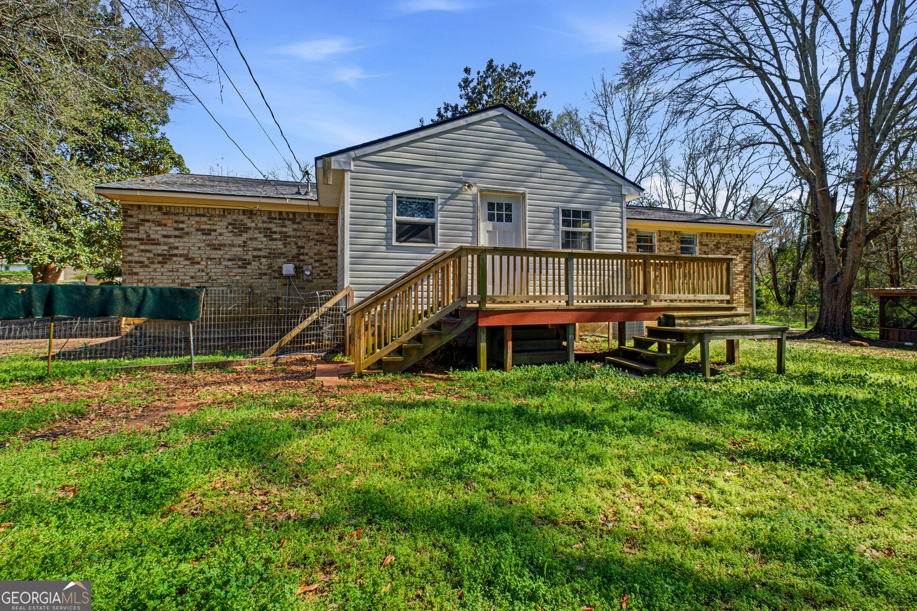 4124 Mangum Mill Road Gainesville, GA 30507 - Photo 34 of 48 a view of a house with a yard