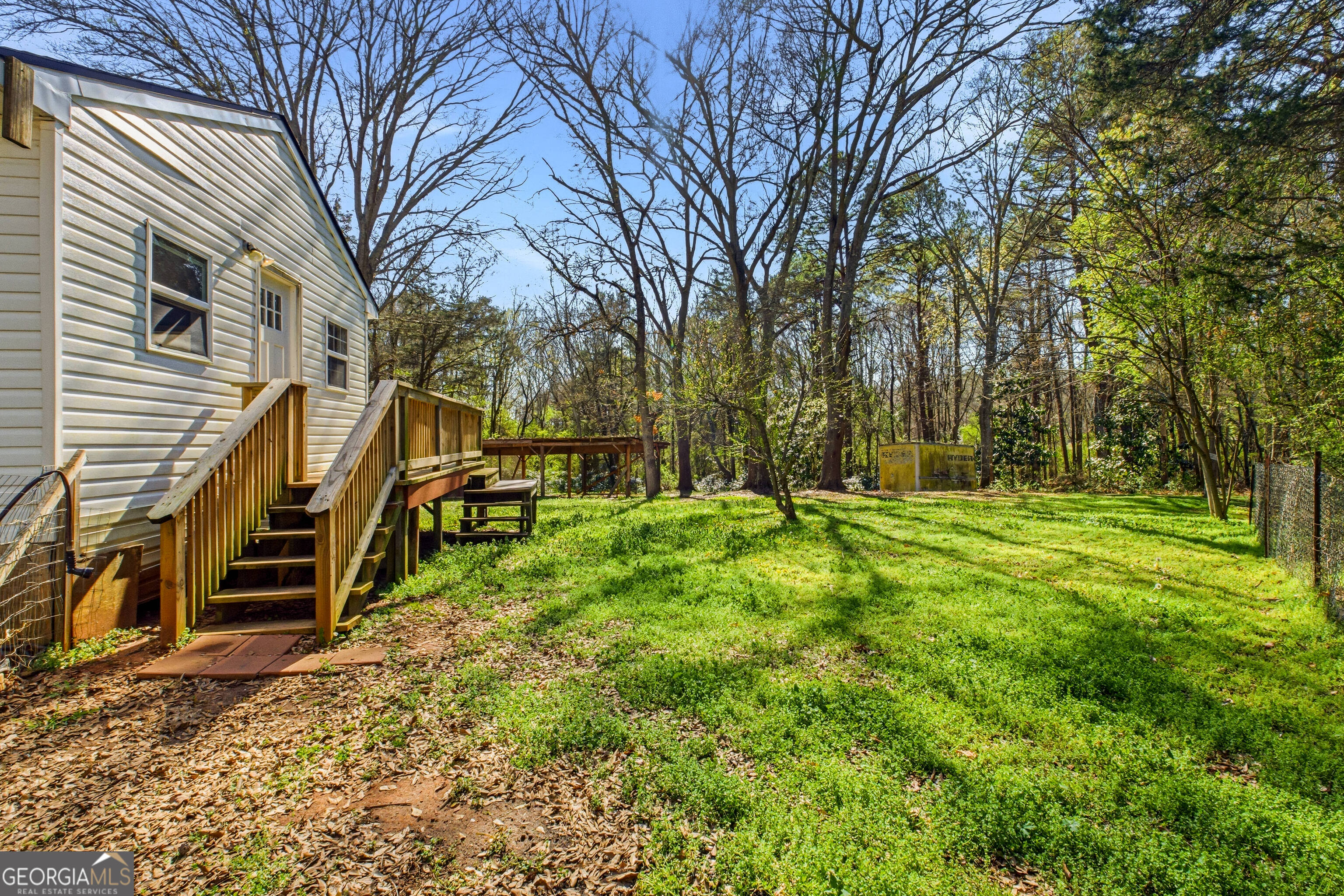 4124 Mangum Mill Road Gainesville, GA 30507 - Photo 35 of 48 a backyard of a house with lots of green space