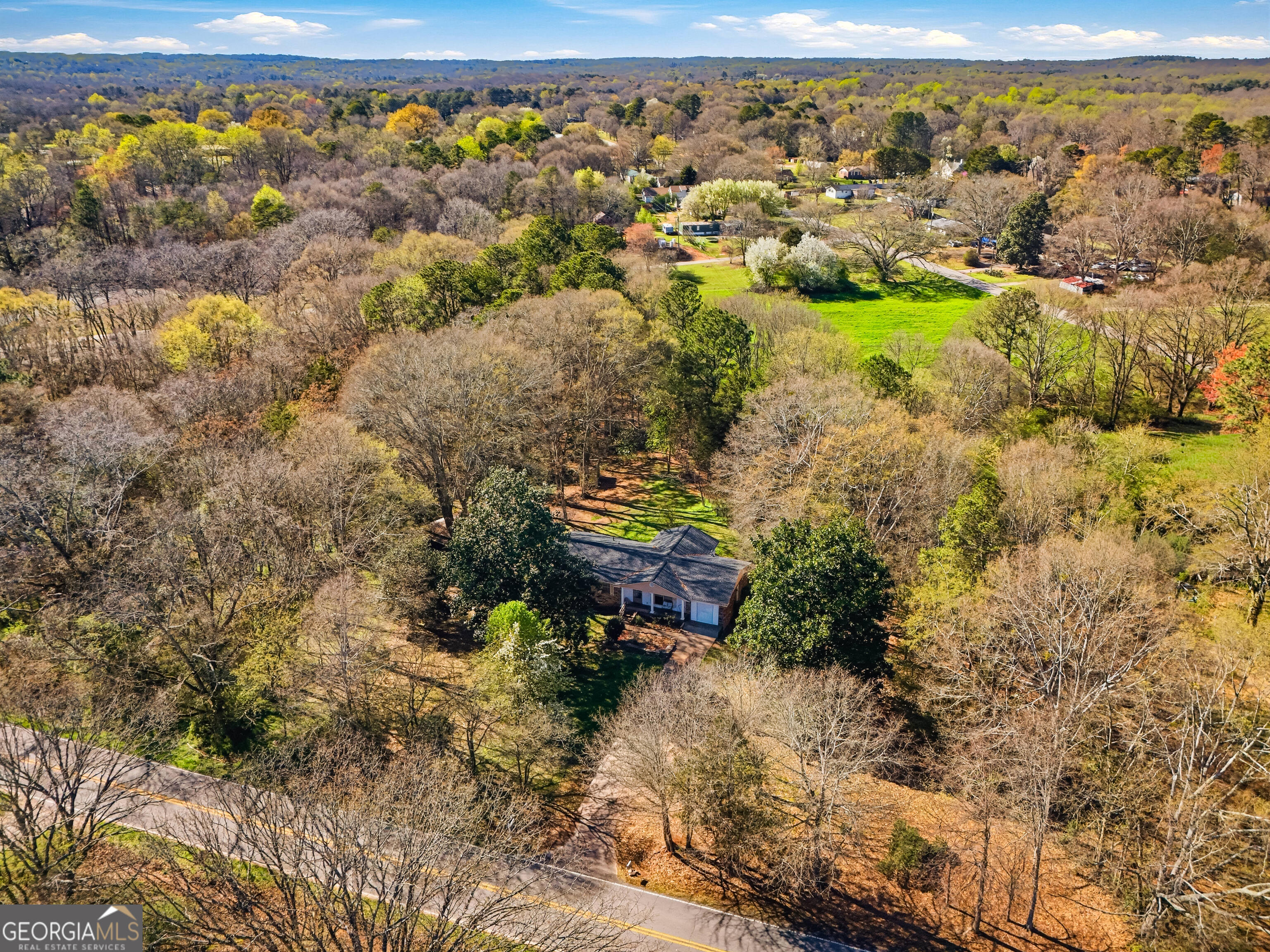 4124 Mangum Mill Road Gainesville, GA 30507 - Photo 39 of 48 a view of a lake with an outdoor space
