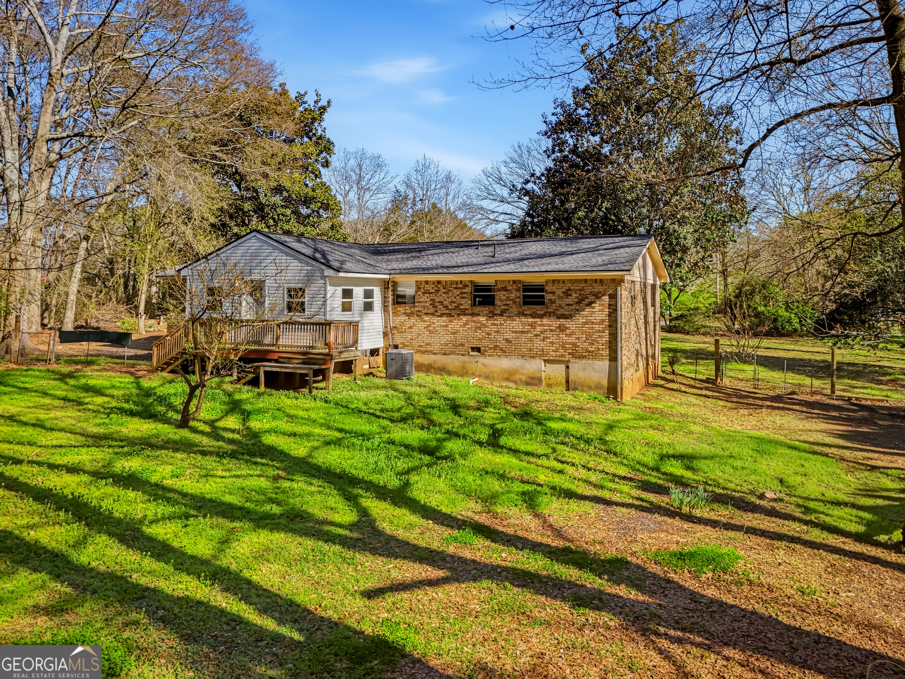 4124 Mangum Mill Road Gainesville, GA 30507 - Photo 42 of 48 a front view of a house with a yard table and chairs