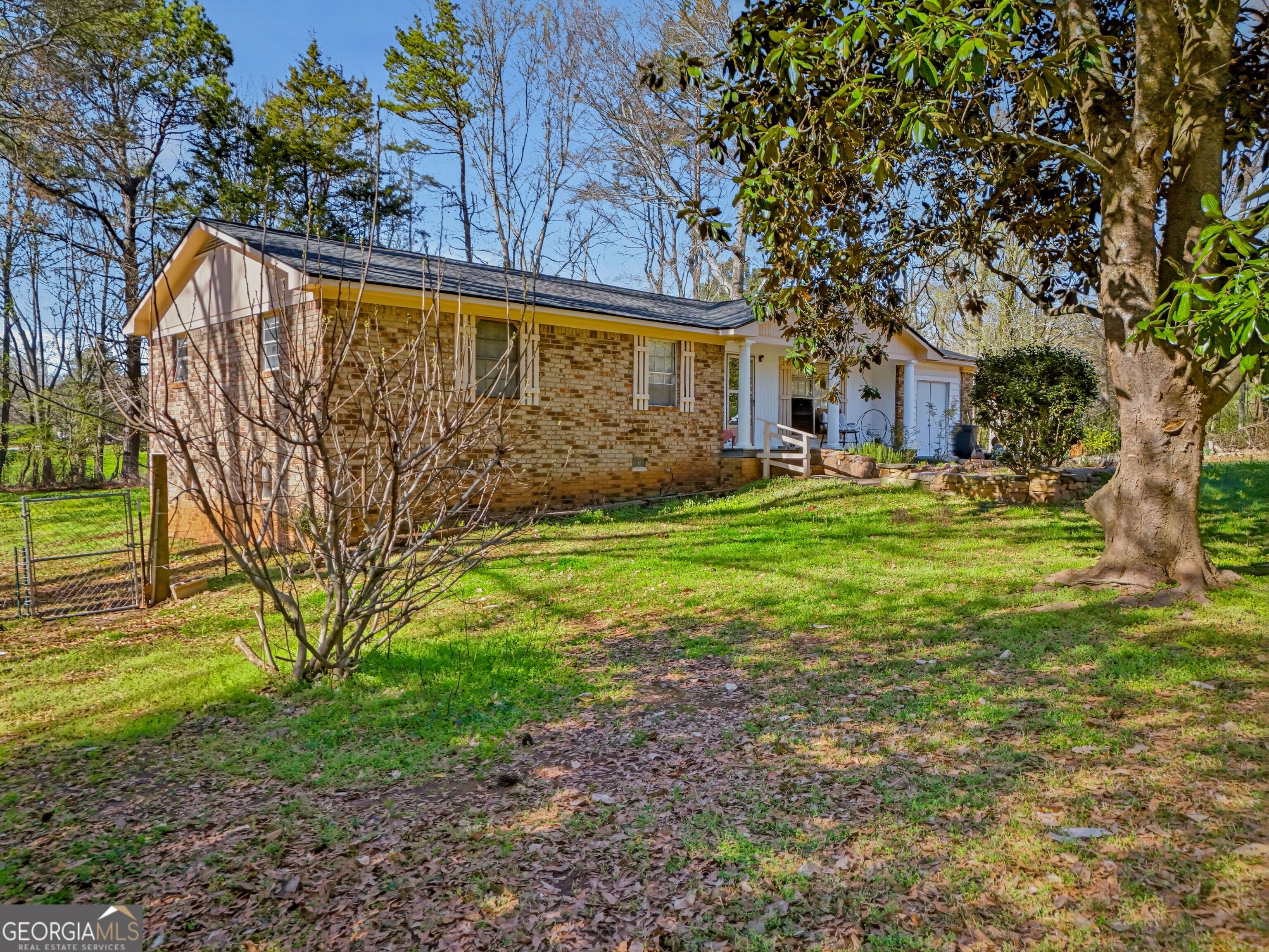 4124 Mangum Mill Road Gainesville, GA 30507 - Photo 45 of 48 a view of a house with a yard