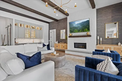 a kitchen with stainless steel appliances granite countertop a kitchen island a stove a table and chairs in it