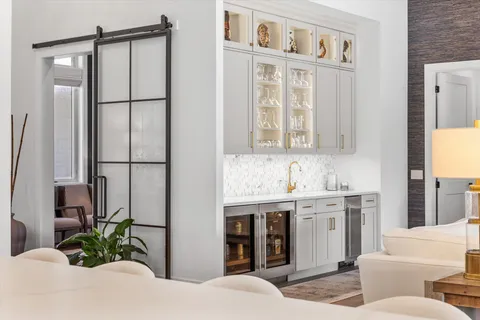 a spacious bathroom with a sink a mirror and a bathtub