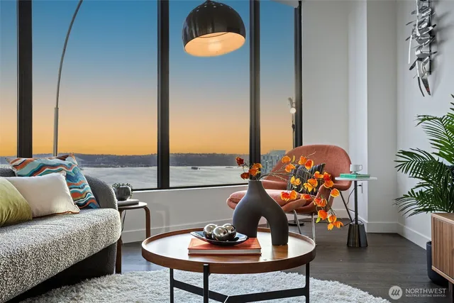 a living room with furniture and a potted plant