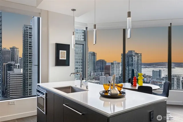 a kitchen counter top with stainless steel appliances