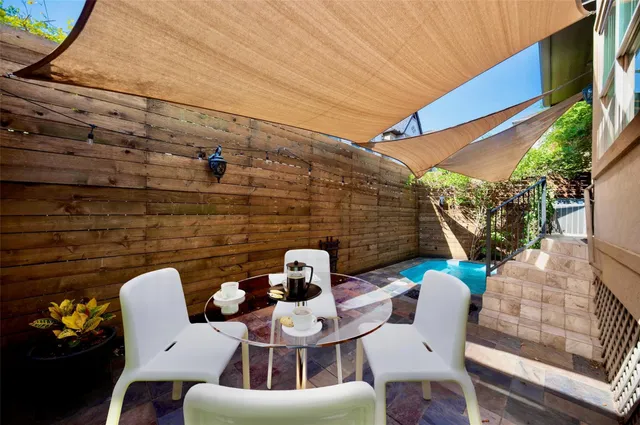a view of a patio with couple of chairs