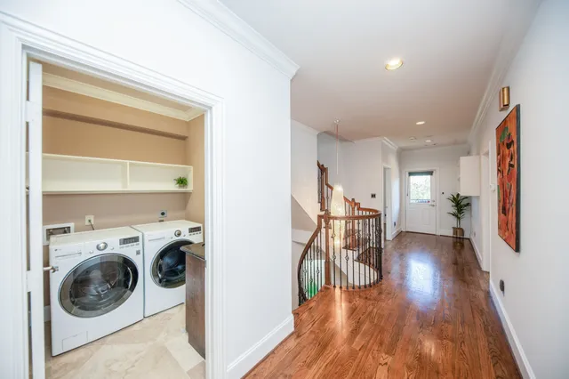 a view of a hallway with washer and dryer