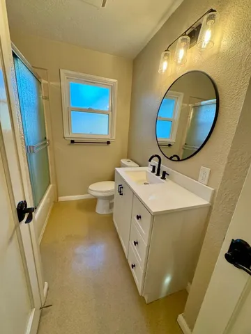 a bathroom with a tub and shower