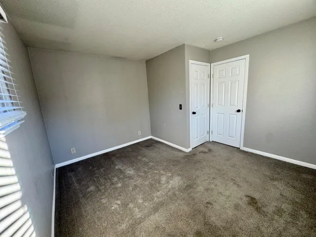 a bathroom with a double vanity sink toilet and shower