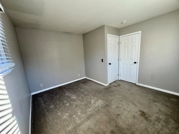 a bathroom with a double vanity sink toilet and shower