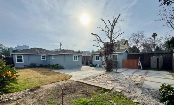 a house with palm tree in front of it