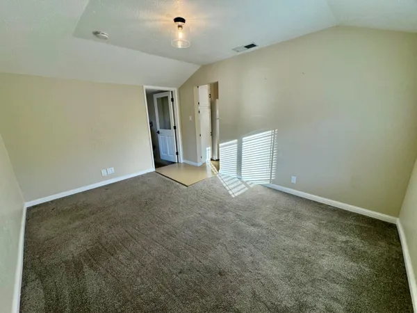 en empty room with windows